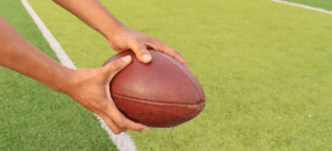 Illustration of a wide receiver wearing XTECH Pads, emphasizing speed and agility, with symbols of advanced protection and performance.