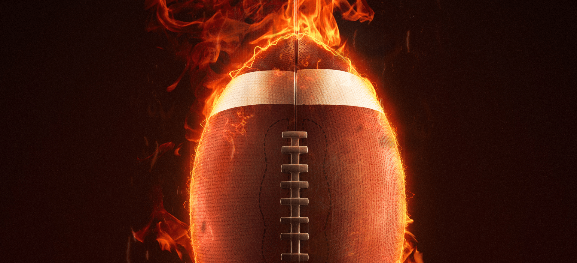 Football engulfed in flames, symbolizing intensity and passion for the sport.